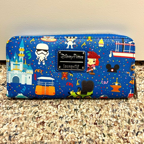 Loungefly Handbags - Lpungfly Disney full zip wallet rides and characters